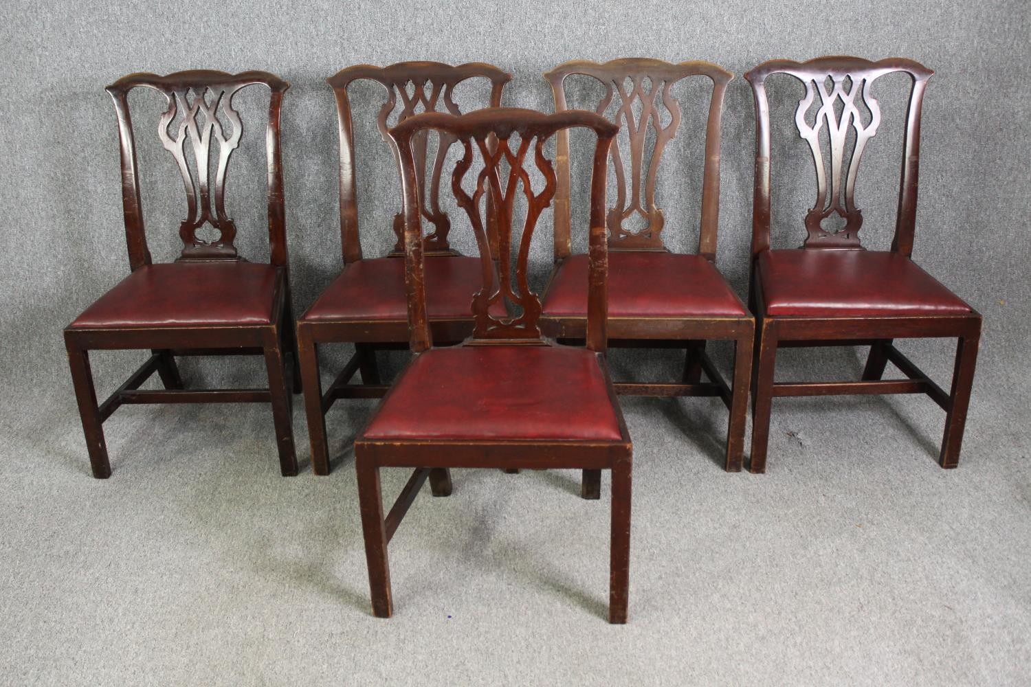 A set of five Chippendale style mahogany dining chairs, late 19th/early 20th century.
