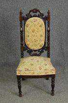 A Victorian carved side chair. H.97cm.