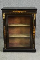 A Victorian ebonized and inlaid pier cabinet, circa 1860 with gilt metal mounts. H.98 W.74 D.32cm.