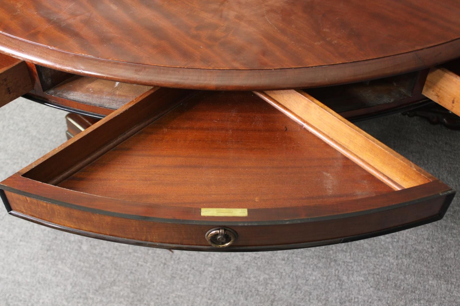 A late Regency style mahogany drum top dining or centre table, bearing a Waring & Gillows - Image 12 of 16