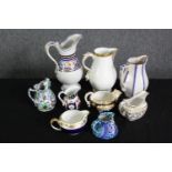 A group of various Staffordshire porcelain jugs. H.24cm. (largest).
