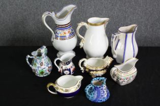 A group of various Staffordshire porcelain jugs. H.24cm. (largest).