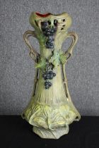 An Art Nouveau pottery vase, in the manner of Royal Dux, early 20th century. H.56cm.