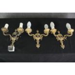 A set of three 18th century style gilt metal wall lights (one broken) H.26 W.27cm. (each).
