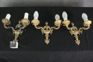 A set of three 18th century style gilt metal wall lights (one broken) H.26 W.27cm. (each).