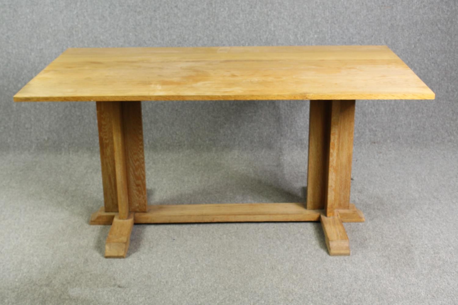 In the manner of Heals, a light oak Arts and Crafts refectory table H.75 W.158 D.86cm.