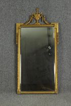 A neoclassical style gilded pier mirror, probably early 20th century. H.125 W.60cm.