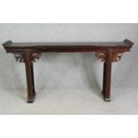 A Chinese hardwood altar console table, 19th century or later. H.98 W.190 D.32cm.