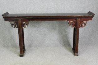 A Chinese hardwood altar console table, 19th century or later. H.98 W.190 D.32cm.