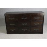 An Eastern hardwood chest of nine drawers. H.90 W.157 D.46cm.