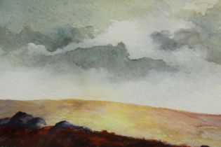 A watercolour landscape of Dartmoor, framed and glazed. H.31 W.49cm.