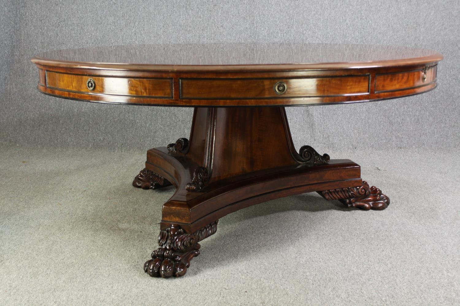 A late Regency style mahogany drum top dining or centre table, bearing a Waring & Gillows - Image 5 of 16