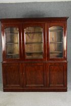 A Victorian triple fronted mahogany library bookcase. H.208 W.188 D.40cm.