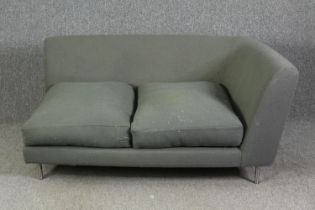 A contemporary corner sofa on chrome supports. H.72 W.150 D.98cm.
