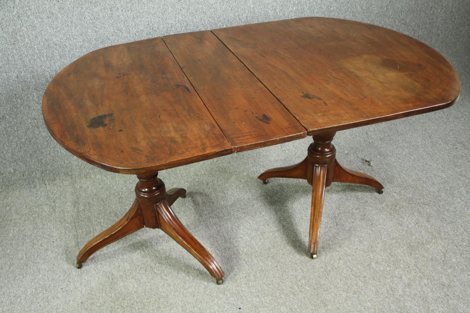 A late Georgian pedestal 'D' end mahogany dining table, with drop flap central leaf. H.73 W.144(ext) - Image 3 of 5