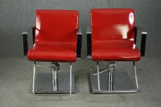A pair of chrome barber shop chairs H.87cm. (each) with faux leather upholstery refinished in