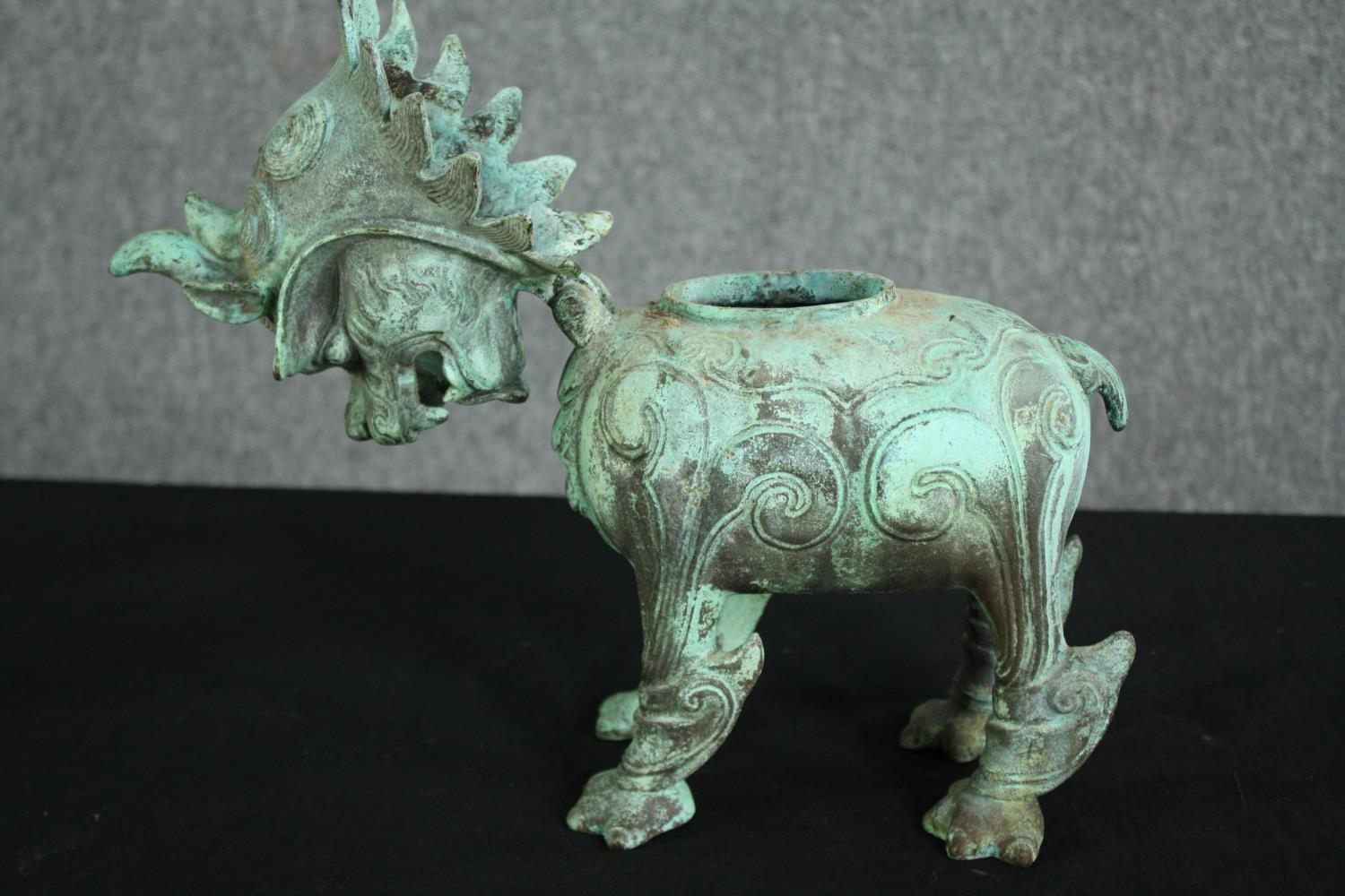 A pair of Chinese Tang style bronzed metal temple lions, with verdigris patination. H.33cm. (each). - Image 3 of 7