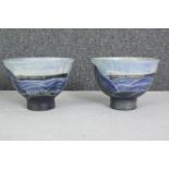 A pair of commemorative glazed earthenware bowls depicting the freight ship 'Canada Marquis', signed