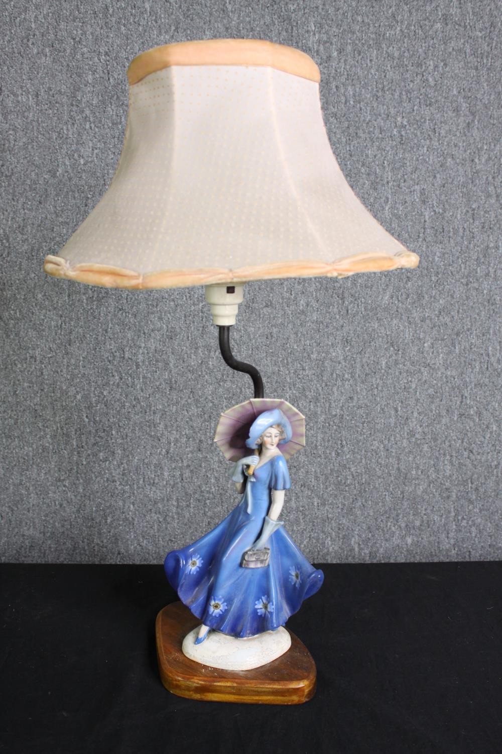 A Doulton style figural table lamp, two white painted metal reading lamps and a turned wooden lamp - Image 4 of 6