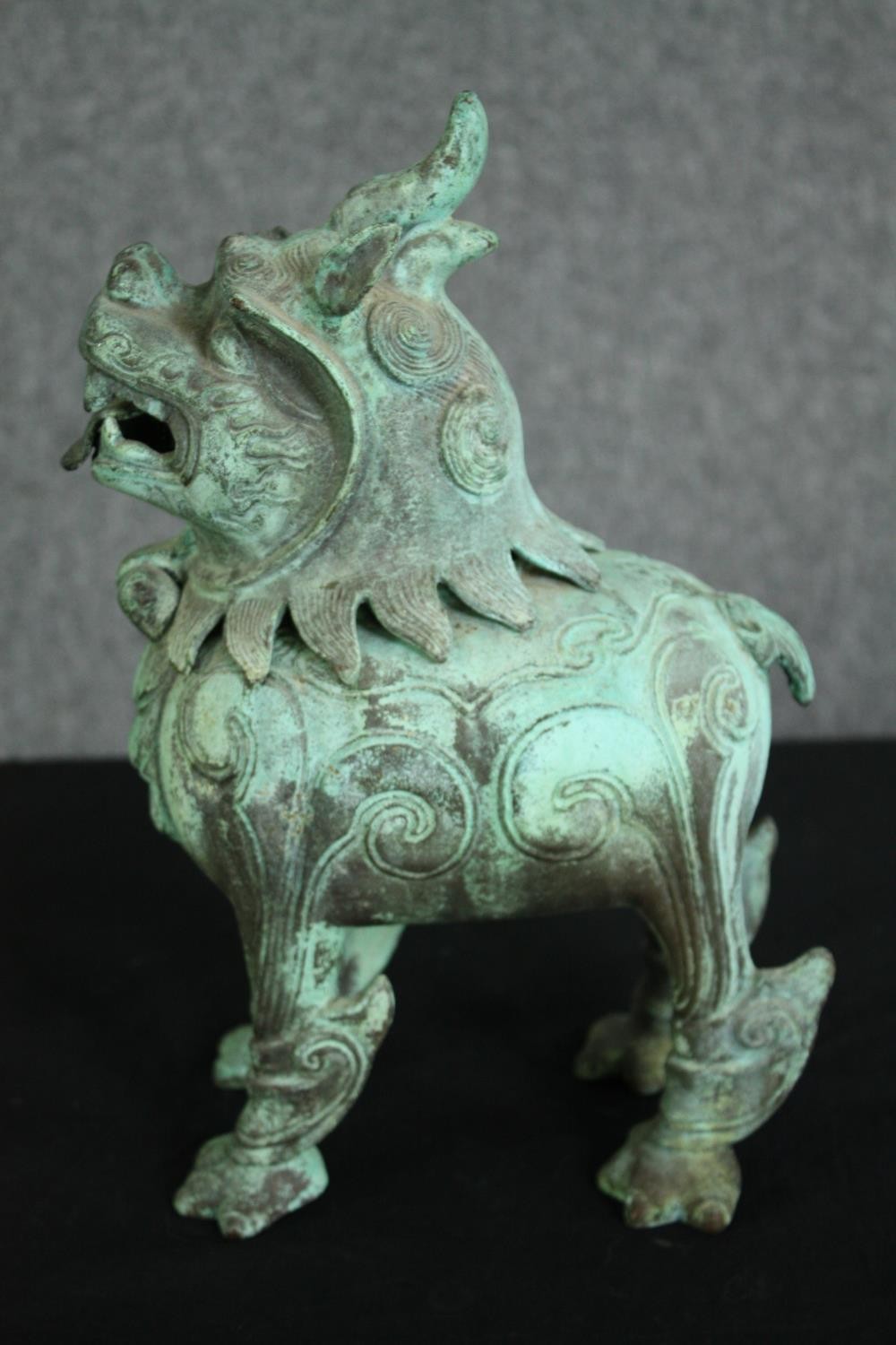 A pair of Chinese Tang style bronzed metal temple lions, with verdigris patination. H.33cm. (each). - Image 2 of 7
