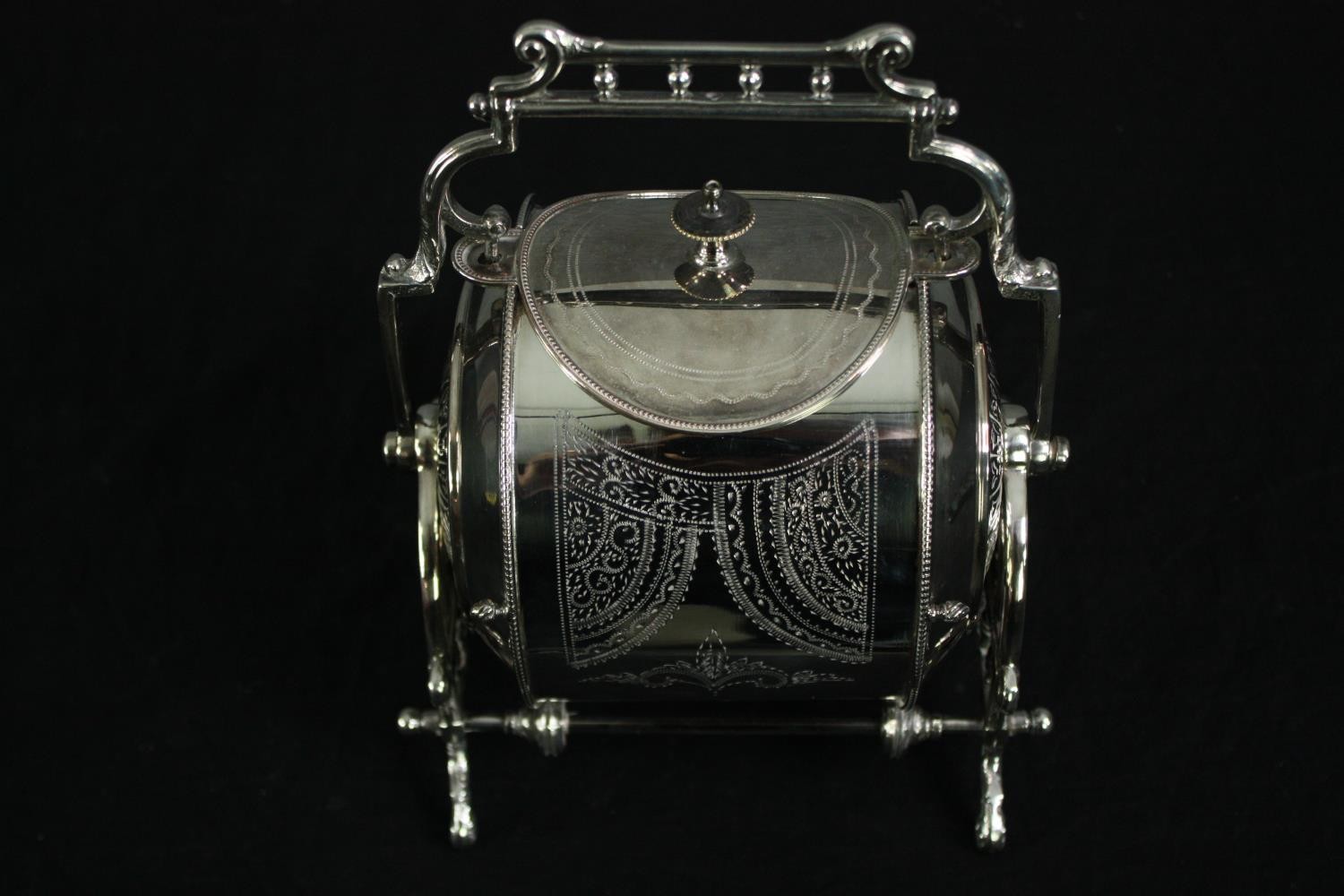 A 19th century silver plated biscuit barrel with engraved decoration, marked to the underside. H. - Image 2 of 8