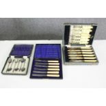 A group of three cased silver plated sets of cutlery, including cake knives, fish knives and