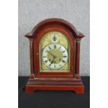 A walnut mantel clock in the Georgian style. H.42 W.34 D.20cm.