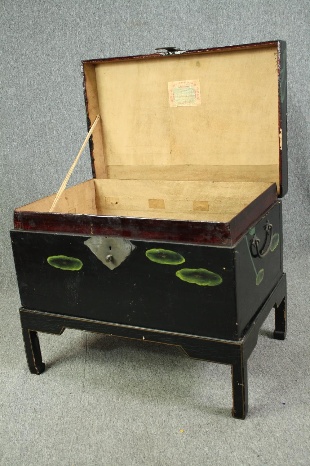 A Chinese black lacquered travelling chest on stand, hand decorated with peonies, early 20th - Image 4 of 6