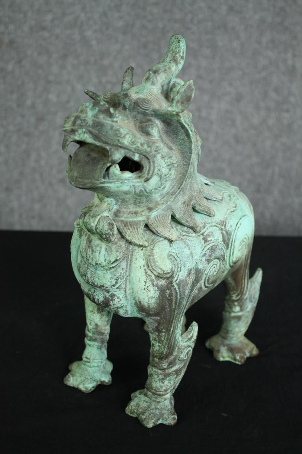 A pair of Chinese Tang style bronzed metal temple lions, with verdigris patination. H.33cm. (each). - Image 4 of 7