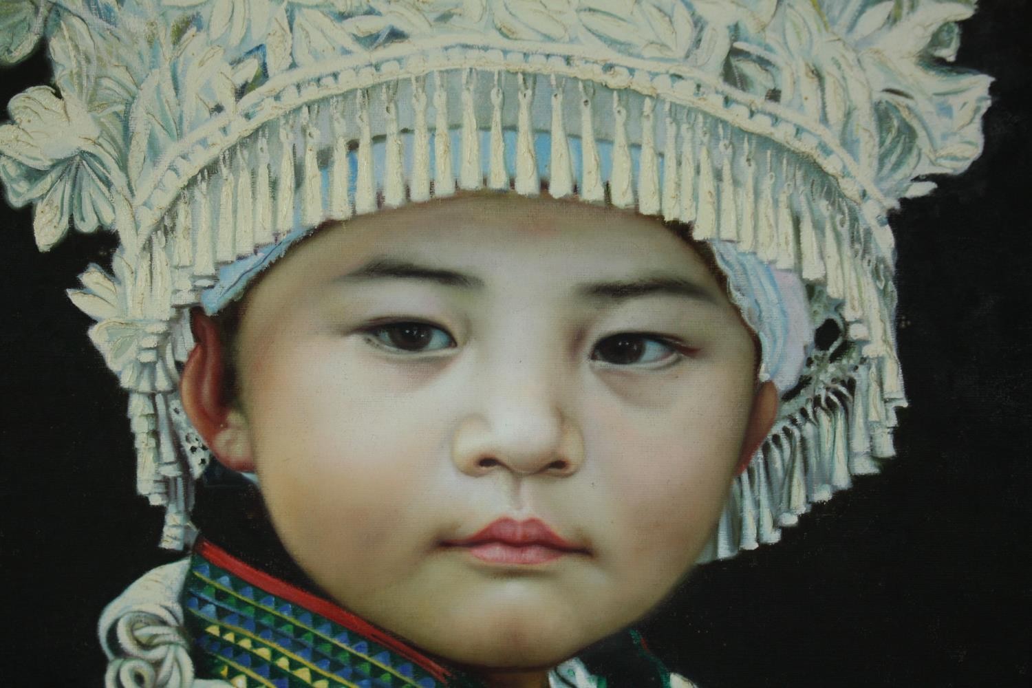 Oil on canvas, portrait of a young Eastern girl in a Hmong Miao headdress, within a hardwood