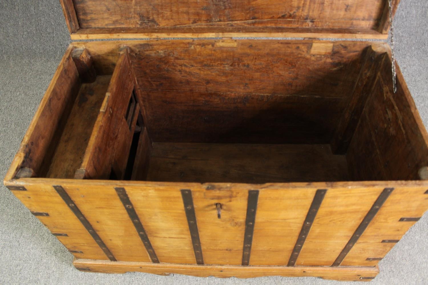 A continental pitch pine and metal bound lidded chest, probably 19th century, H.70 W.110 D.60cm. - Image 5 of 12