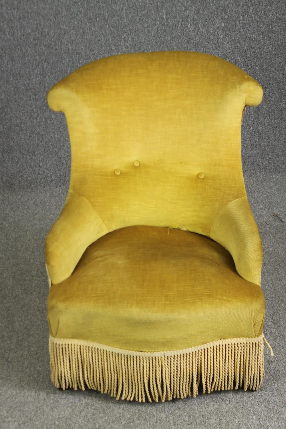 A Victorian wing back upholstered easy chair.