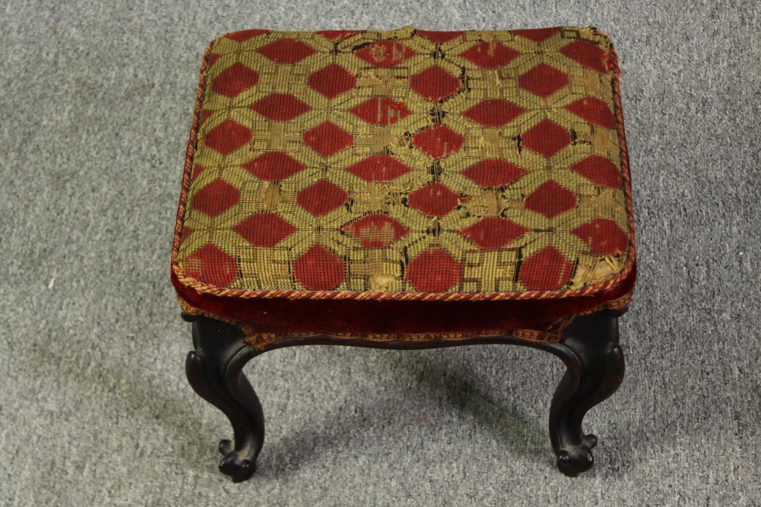 A George II style mahogany foot stool, with diaper pattern needlepoint upholstery, probably 19th