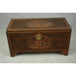 A 1920's Chinese camphorwood chest. H.50 W.93 D.45cm.