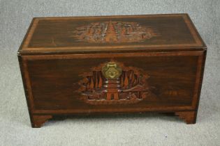 A 1920's Chinese camphorwood chest. H.50 W.93 D.45cm.