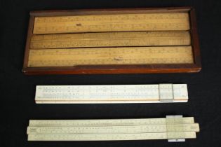 A group of vintage slide rules. L.34 W.13cm. (box).