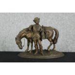 A spelter group of a man and horse. H.19cm.