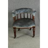 A late Victorian walnut tub chair, with button back upholstery