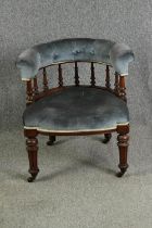 A late Victorian walnut tub chair, with button back upholstery