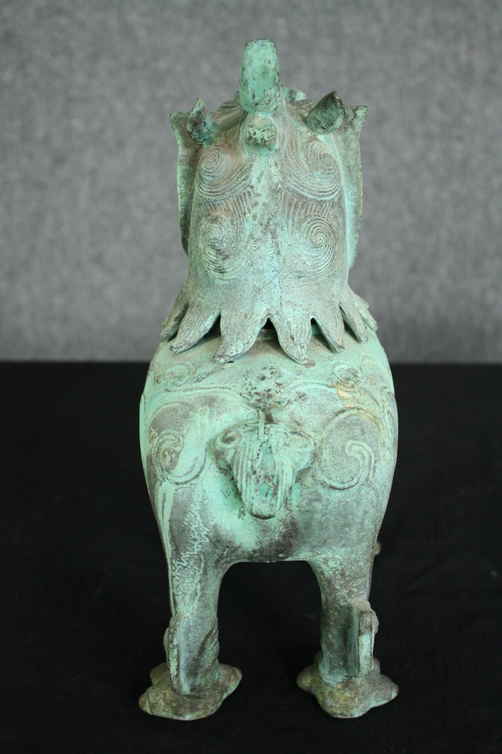 A pair of Chinese Tang style bronzed metal temple lions, with verdigris patination. H.33cm. (each). - Image 6 of 7