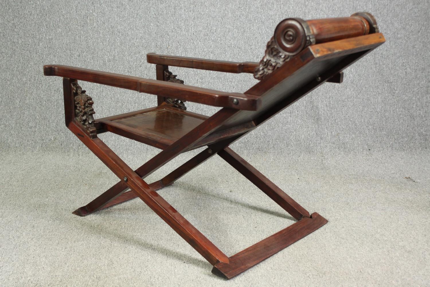 A Chinese carved hardwood folding chair, 19th century. H.78 W.112 D.59cm. - Image 7 of 12