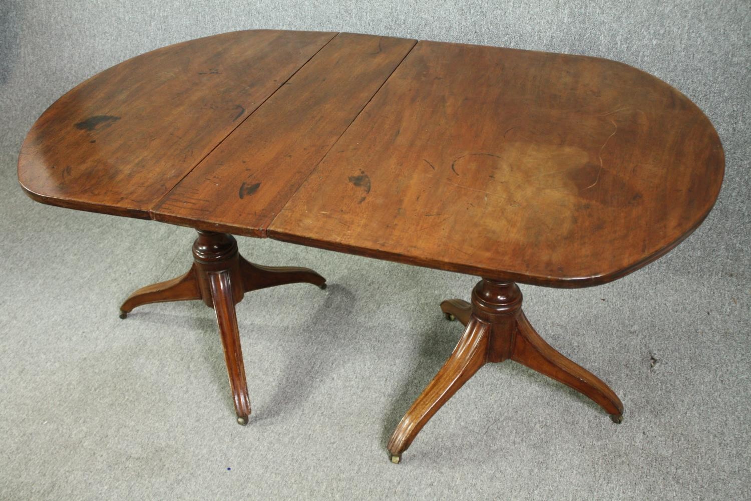 A late Georgian pedestal 'D' end mahogany dining table, with drop flap central leaf. H.73 W.144(ext) - Image 4 of 5