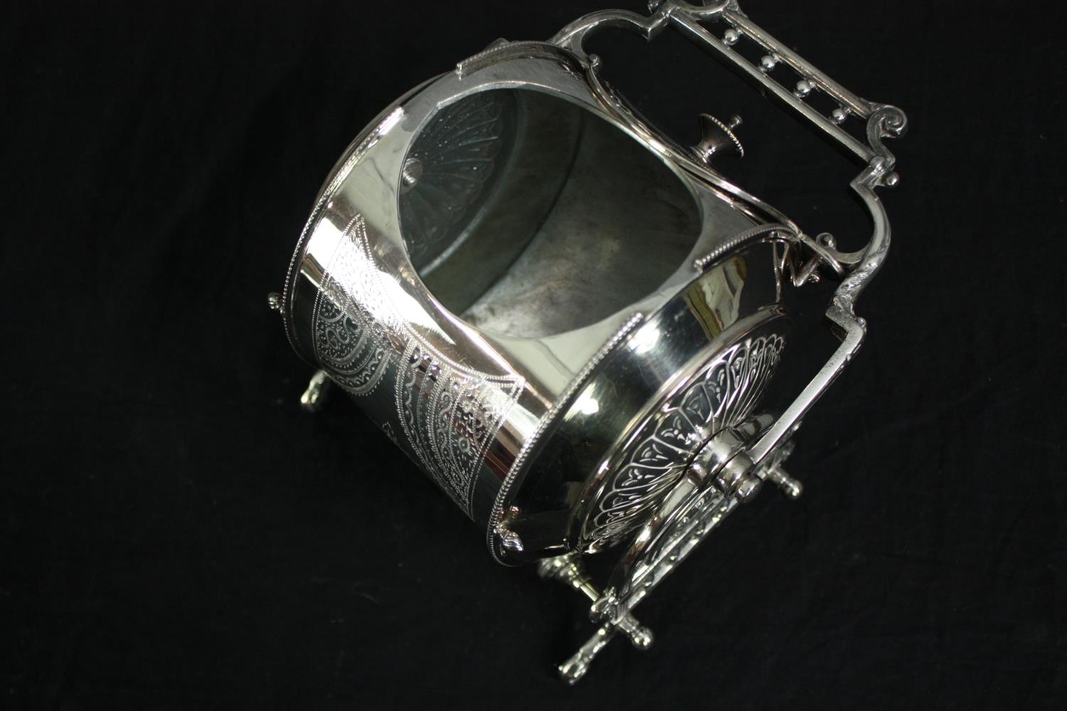 A 19th century silver plated biscuit barrel with engraved decoration, marked to the underside. H. - Image 6 of 8