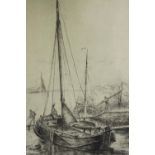 An etching of a moored sailing boat, framed and glazed. H.40 W.30cm.