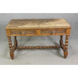 A Victorian carved oak side table, circa 1870, in the 17th century manner, with two frieze