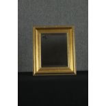 A giltwood wall mirror. H.50 W.42cm.