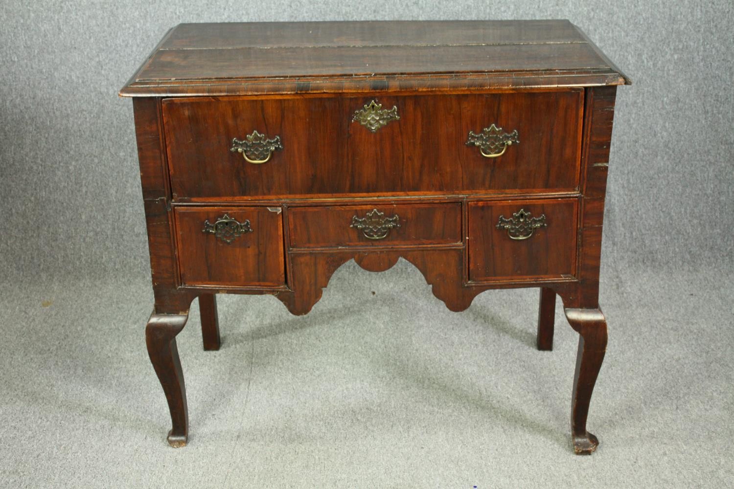 A George I walnut and feather strung lowboy. H.92 W.103 D.54cm.