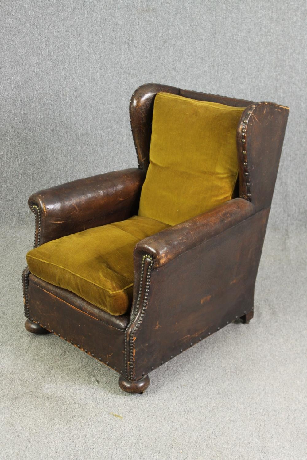 A leather and upholstered club chair. H.88 W.73 D.70cm, early 20th century. - Image 3 of 6