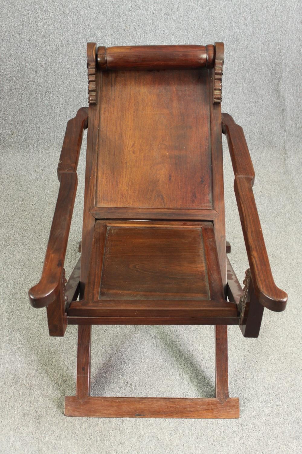 A Chinese carved hardwood folding chair, 19th century. H.78 W.112 D.59cm. - Image 2 of 12