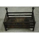 A cast iron fire grate. H.36 W.61 D.36cm.